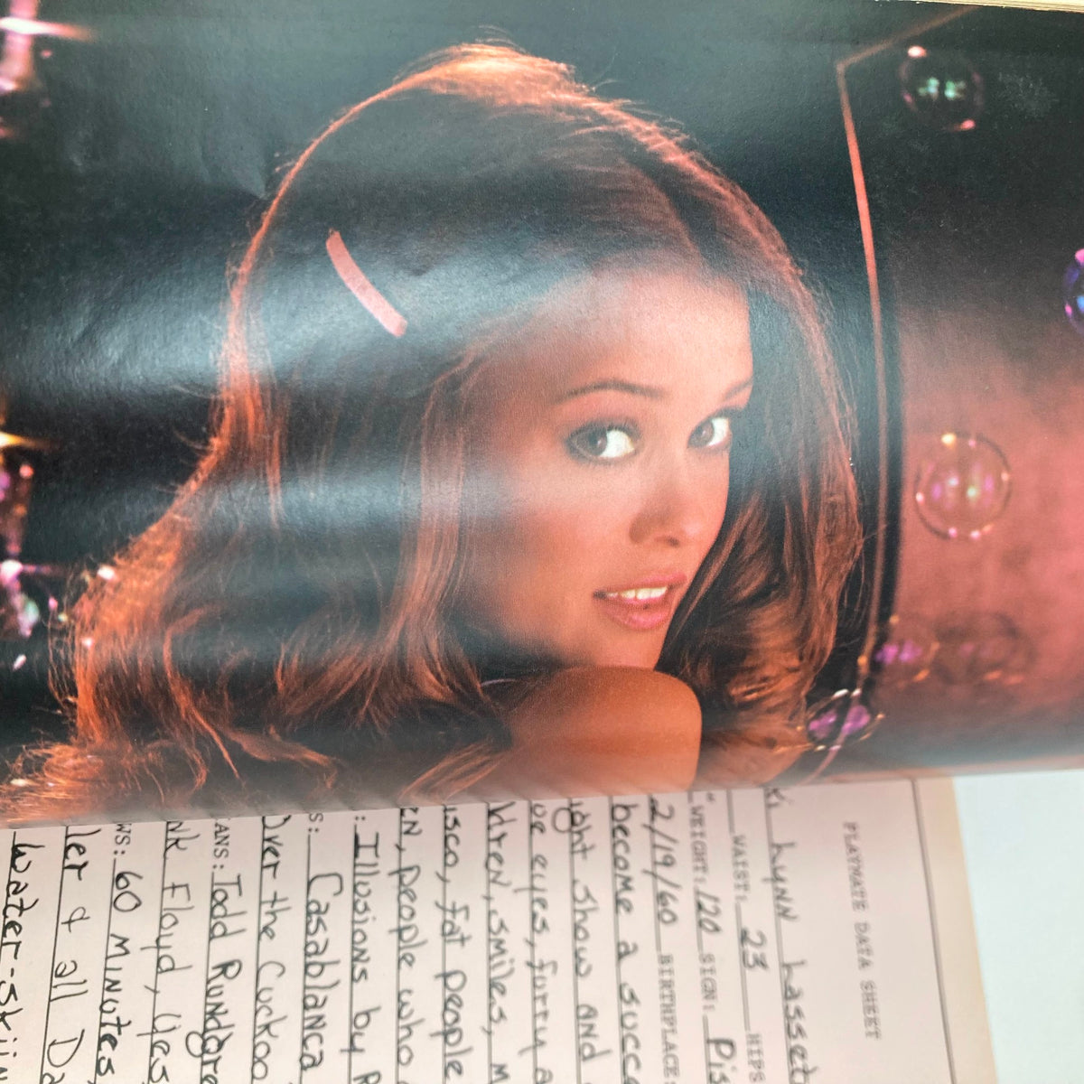 Inside of VTG Playboy Magazine February 1981, featuring a stunning photograph of centerfold Vicki Lasseter, with a vibrant background and charming pose.