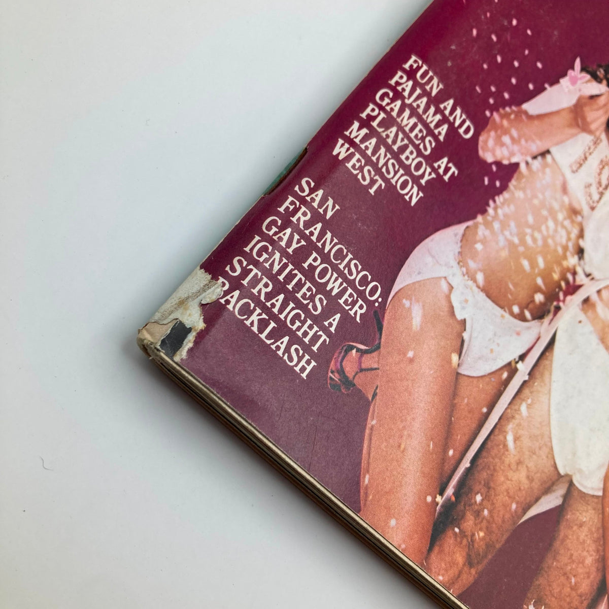 Close-up image of the Vintage Playboy Magazine January 1980 showing the side of the cover with text about features inside, such as fun and pajama games at Playboy Mansion West and a mention of gay power in San Francisco.