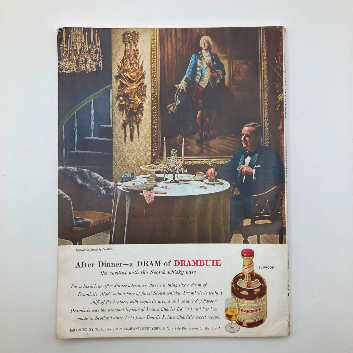 Back cover of the February 1959 VTG The Atlantic Magazine featuring an advertisement for Drambuie, showing a luxurious dining setting with a man in formal attire.