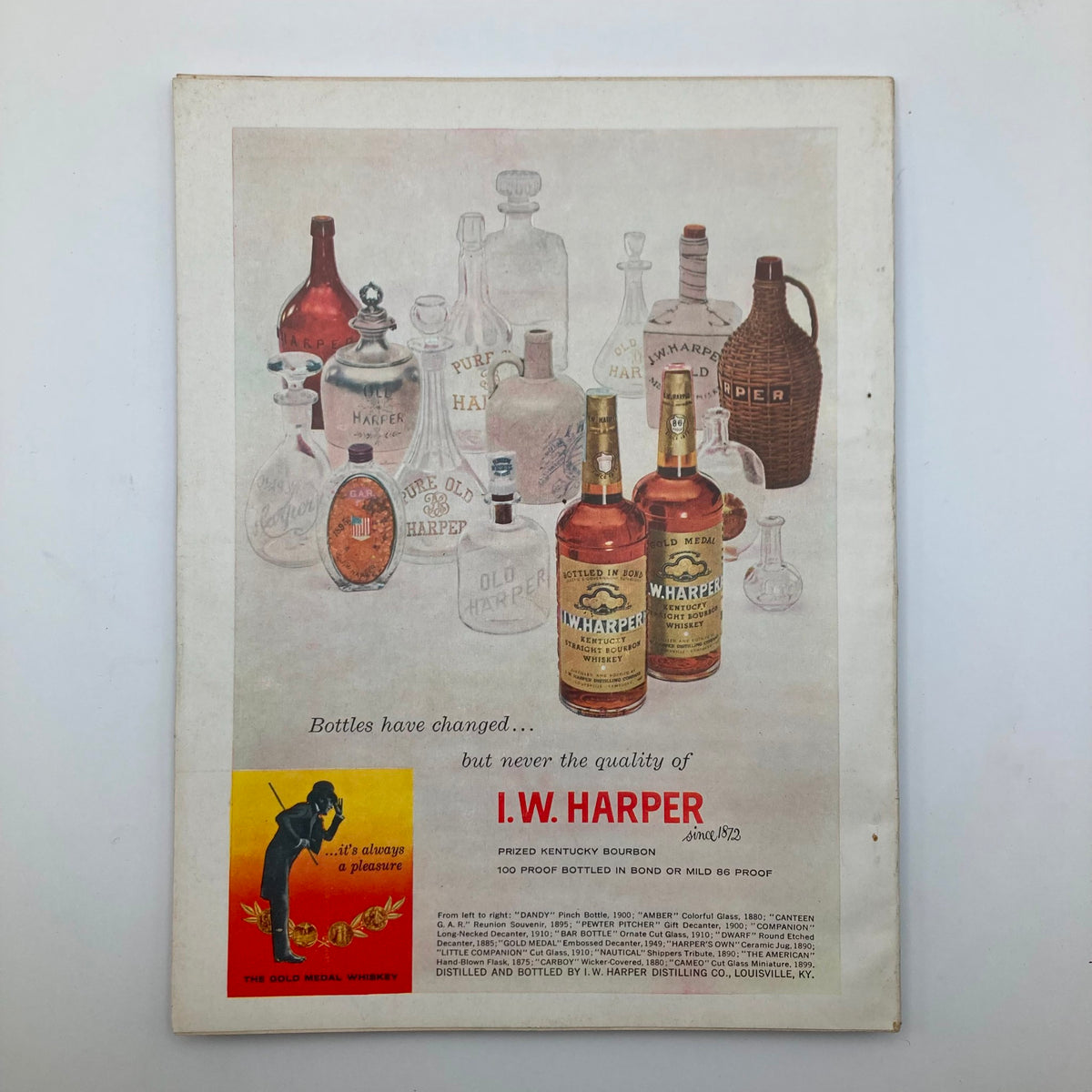 Back cover of VTG Harper's Magazine April 1958 showcasing an advertisement for I.W. Harper bourbon with vintage bottle illustrations.