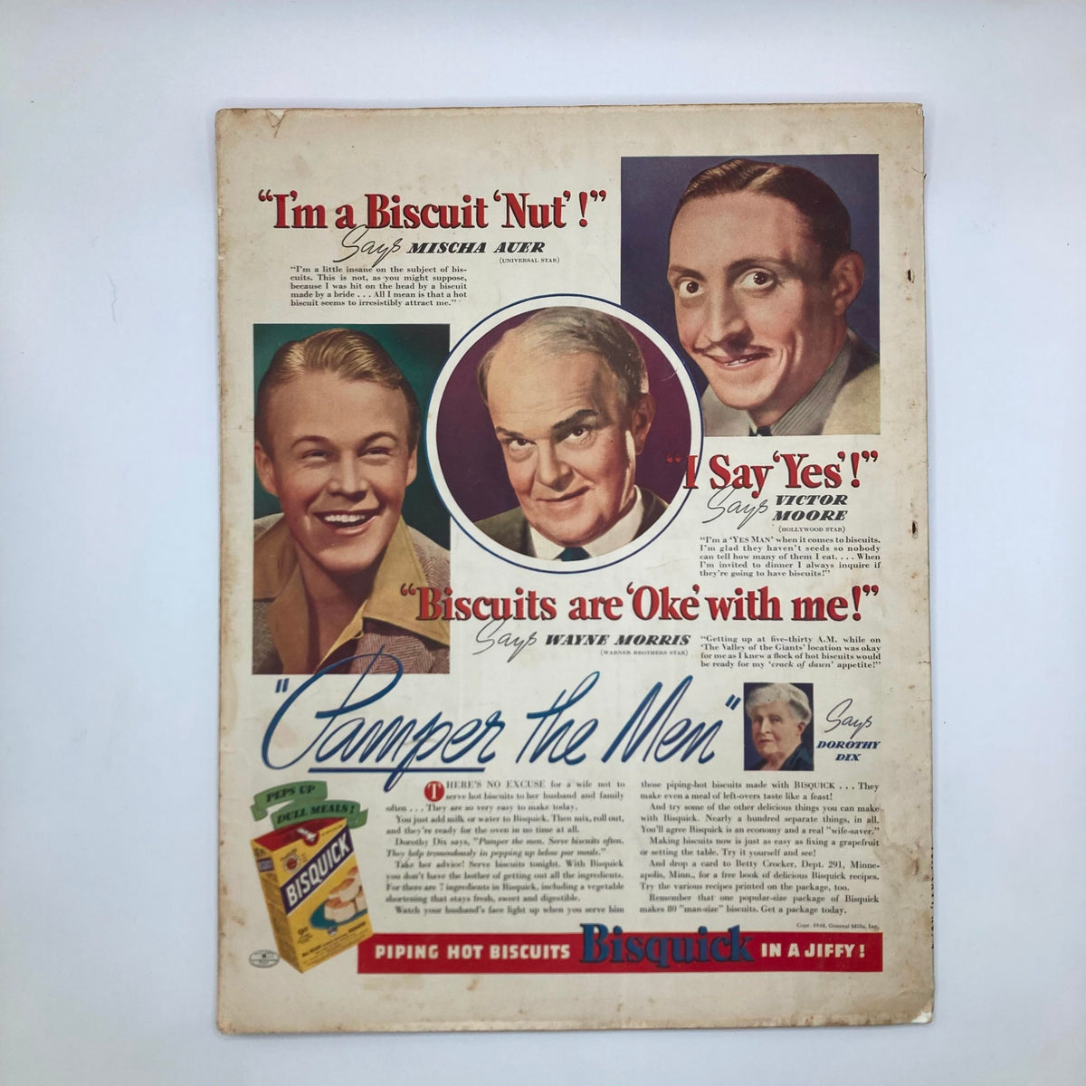 Vintage advertisement from 1939 featuring Bisquick, promoting biscuits with testimonials from actors Mischa Auer, Victor Moore, and Wayne Morris, under the theme 'Pamper the Men'. Includes nostalgic imagery characteristic of classic magazine layouts.