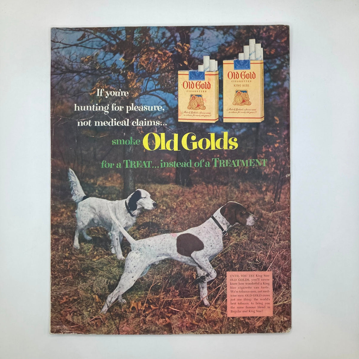 Back cover of the Saturday Evening Post Magazine, November 21, 1953, showcasing an advertisement for Old Gold cigarettes with two dogs in a forest setting.