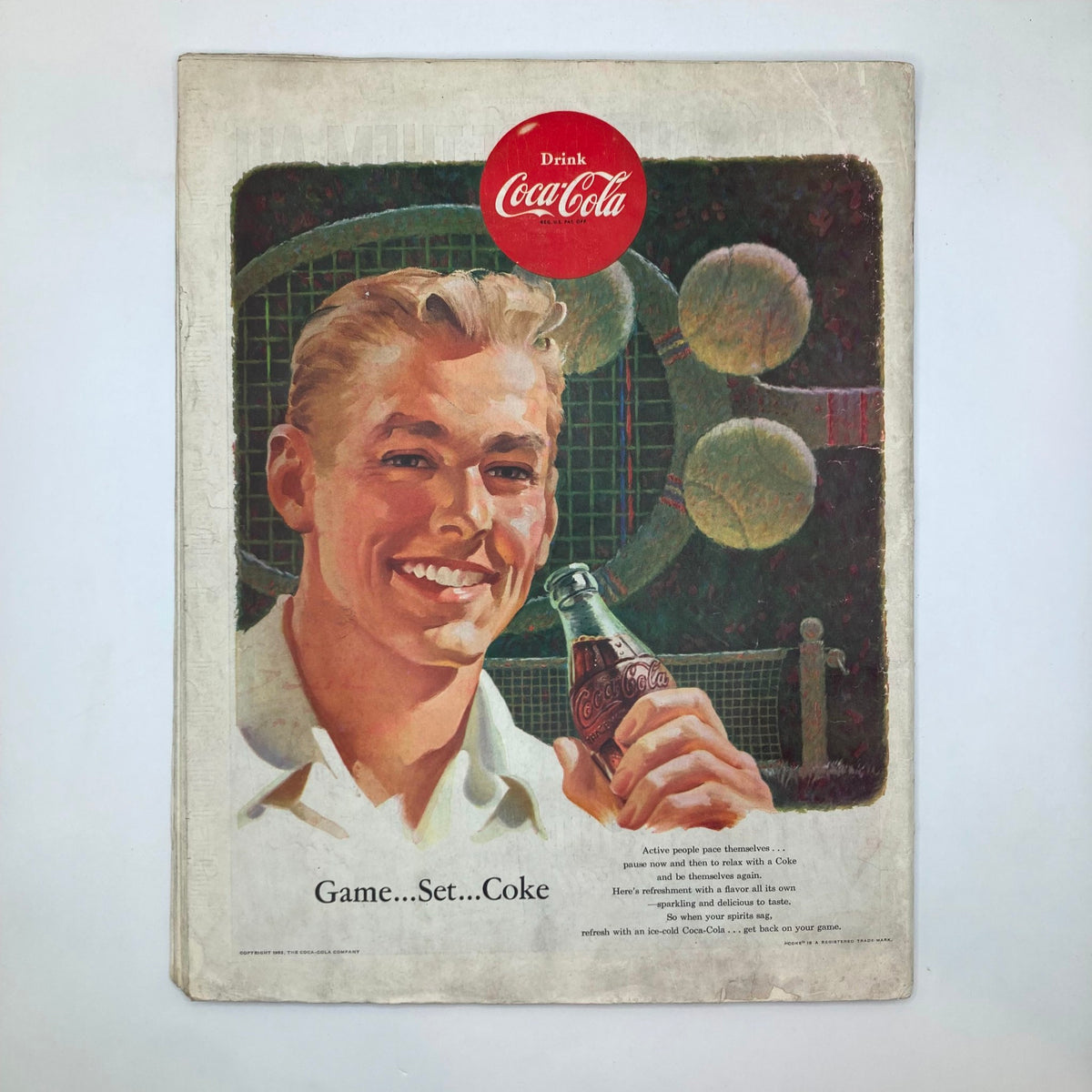 Advertisement page from the Saturday Evening Post Magazine September 5, 1953, showcasing a Coca-Cola ad with a smiling man holding a Coke bottle.