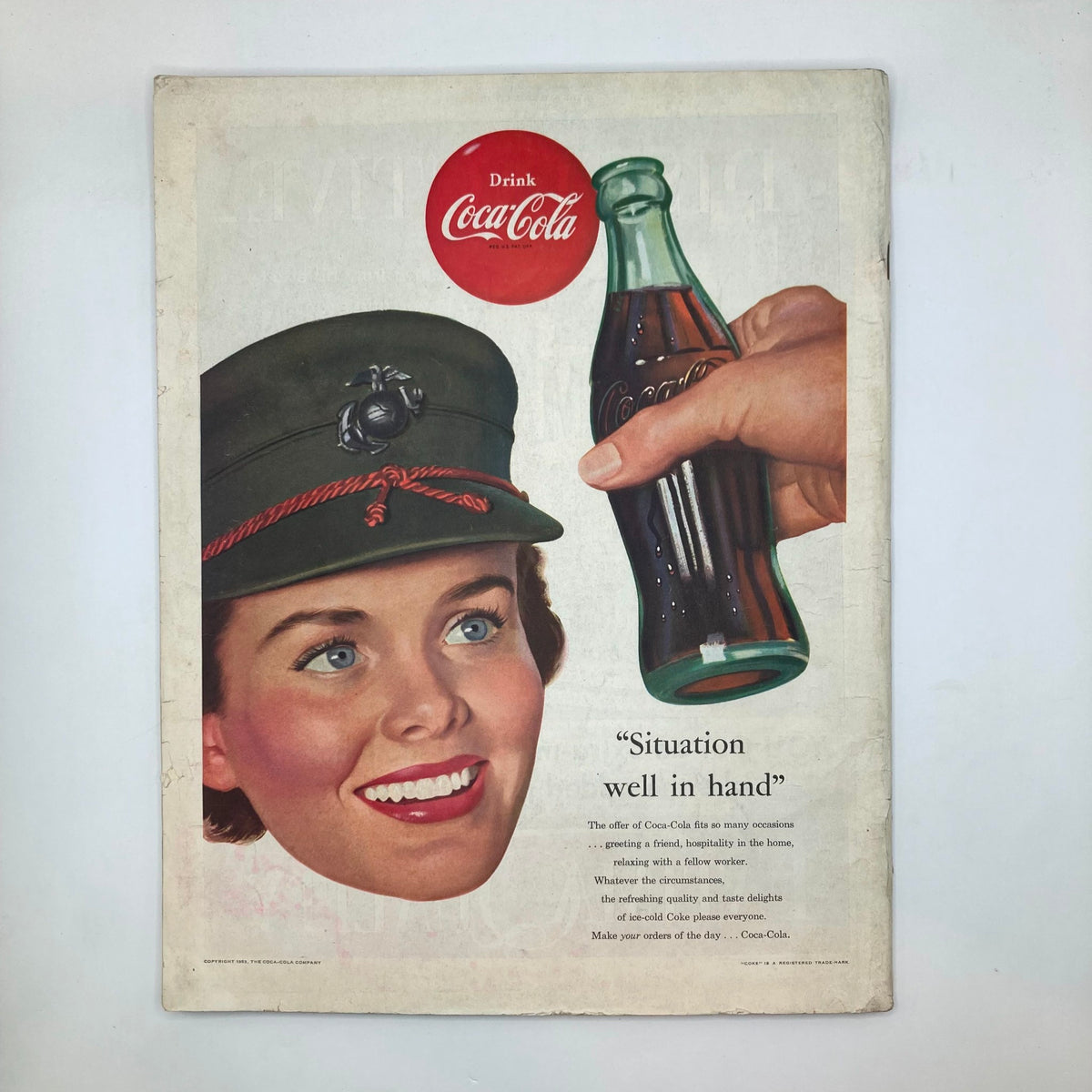 Advertisement in Saturday Evening Post Magazine February 28, 1953 featuring a young woman in a military cap enjoying Coca-Cola, illustrating 1950s Americana and advertising style.