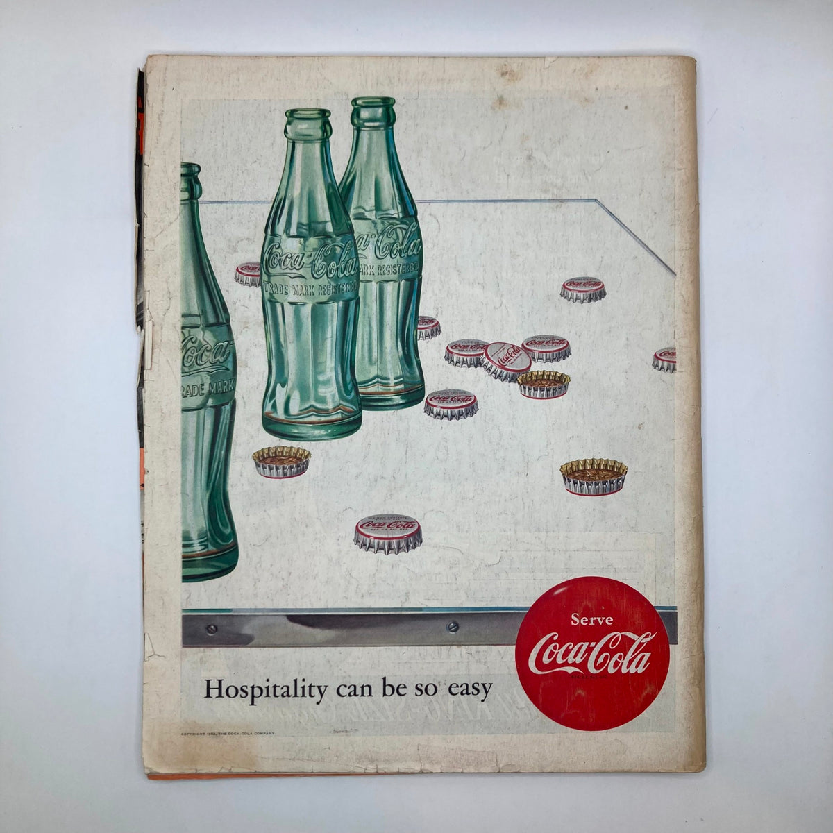 Back cover of Saturday Evening Post Magazine April 19 1953 featuring an advertisement for Coca-Cola with classic bottles.