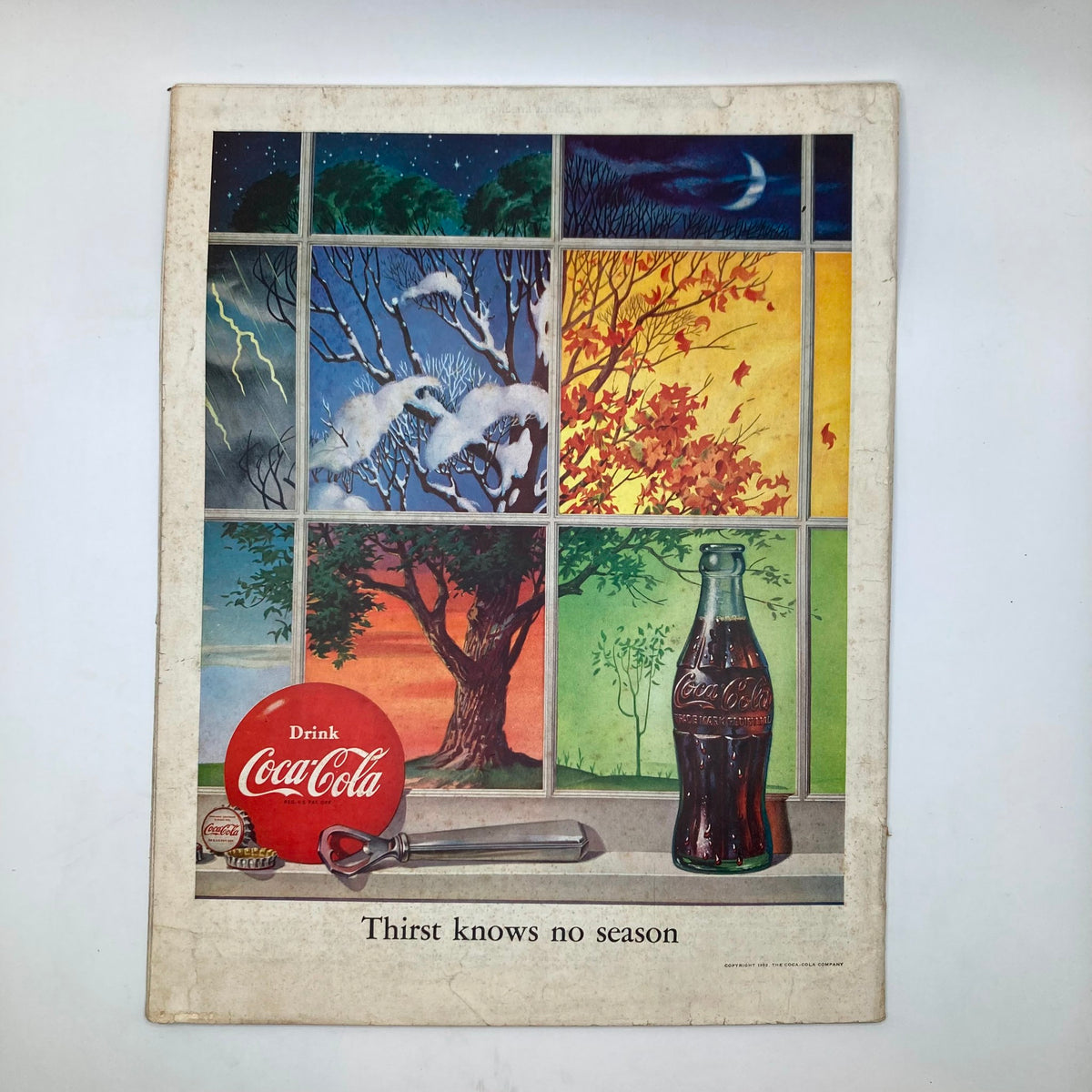 Back cover of the Saturday Evening Post Magazine December 27, 1952, featuring a Coca-Cola advertisement with seasonal imagery and the slogan 'Thirst knows no season.'