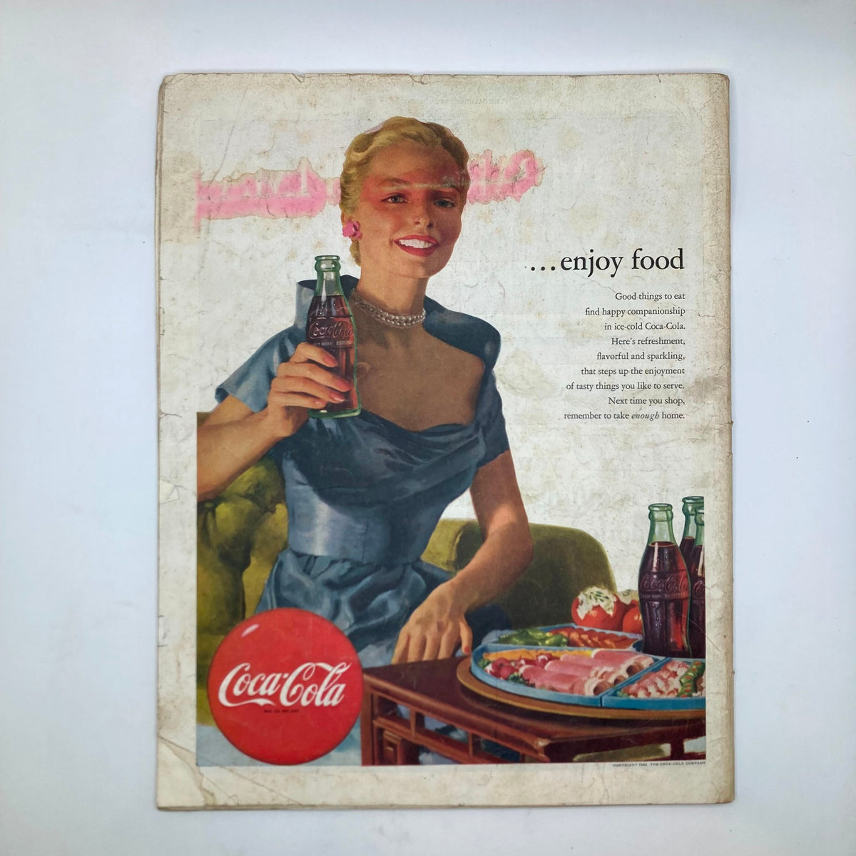 Back cover of Saturday Evening Post Magazine July 12 1952, featuring a Coca-Cola advertisement with a woman enjoying a drink.