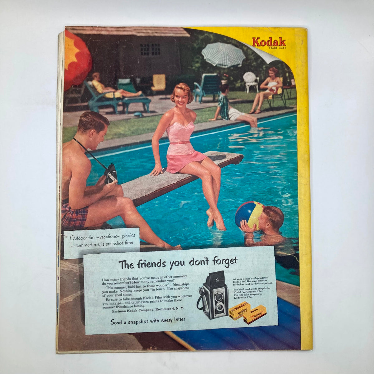 Cover of Saturday Evening Post Magazine June 7 1952 featuring a nostalgic summer pool scene, showcasing vibrant colors and casual outdoor leisure with a woman in a pink swimsuit lounging by the pool and children enjoying water play.
