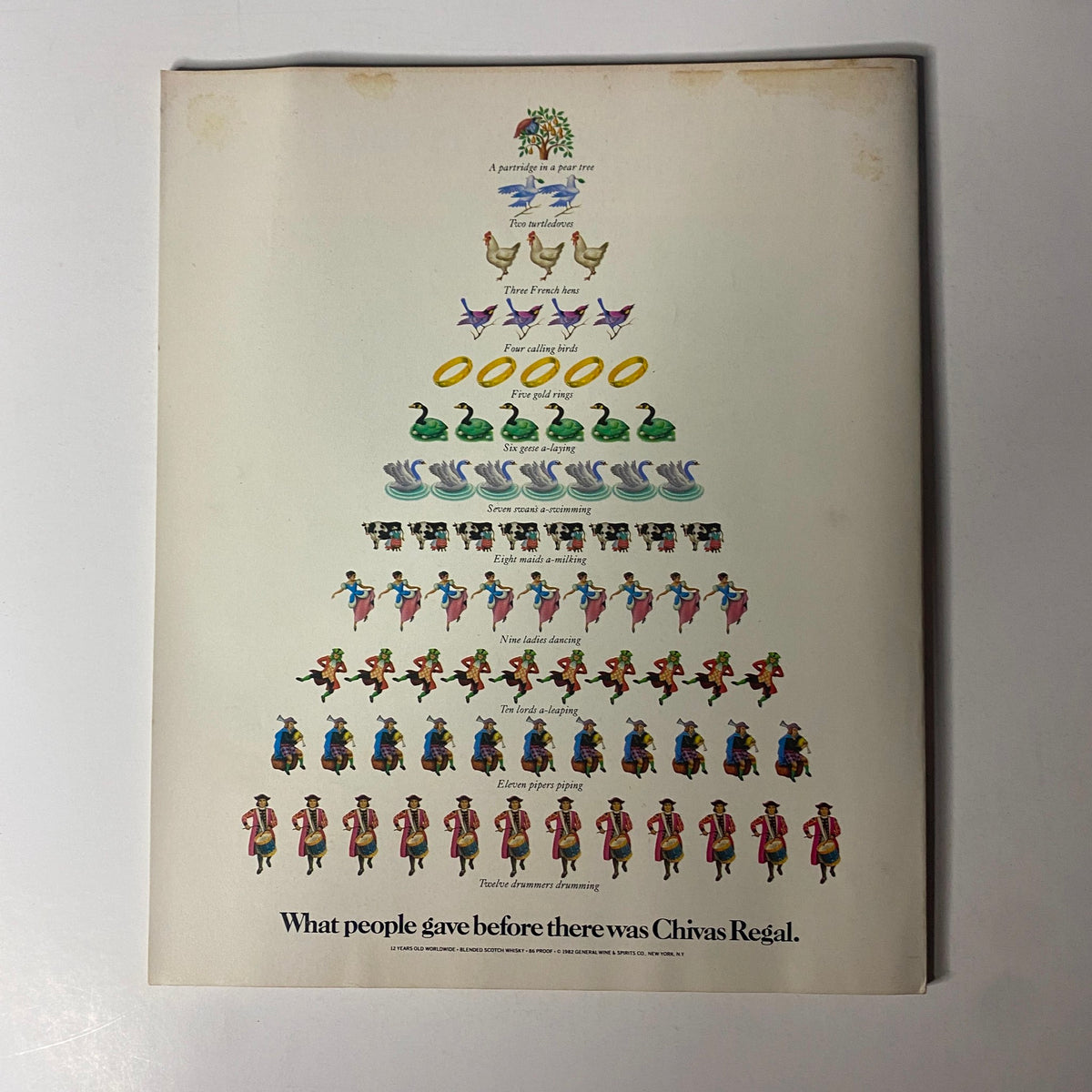 Back cover advertisement of Fortune Magazine December 27, 1982 featuring a whimsical illustration of a tree and a festive message about Chivas Regal.