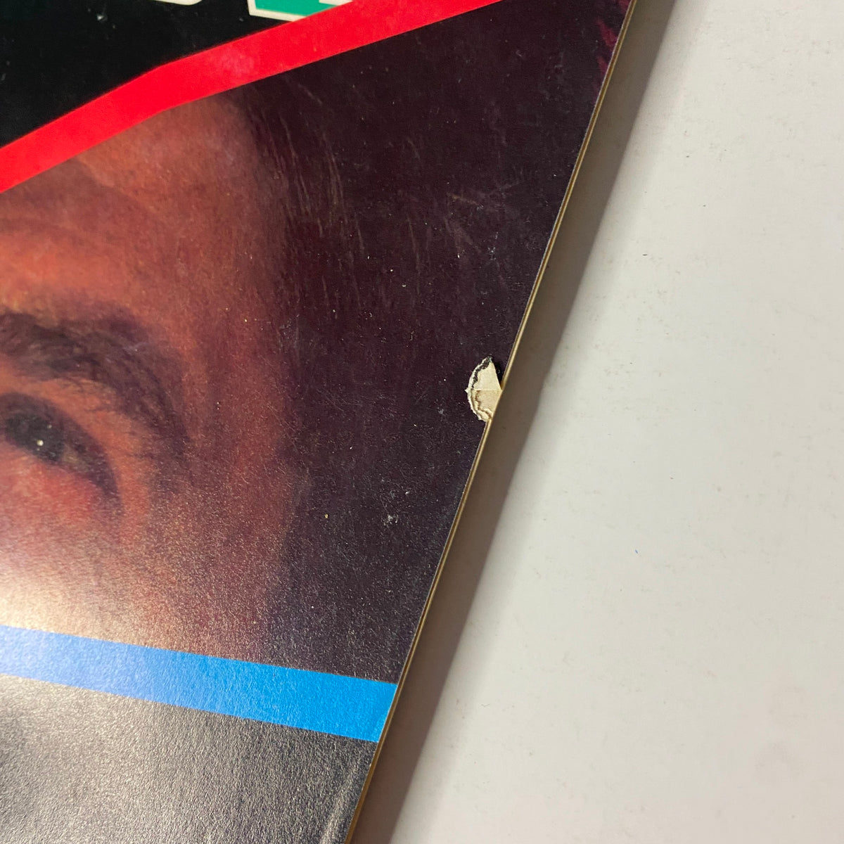 Close-up of the edge of Fortune Magazine, dated February 22, 1982, featuring Ronald Reagan and highlighting minor wear, emphasizing its vintage condition.