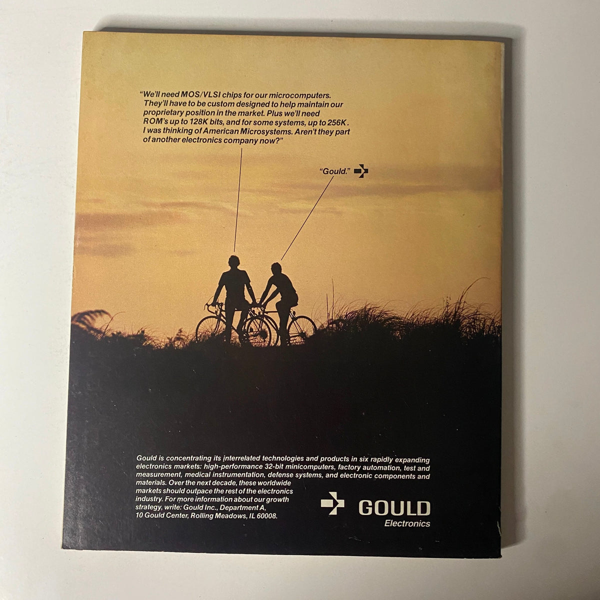Back cover of Fortune Magazine May 2, 1983, featuring a silhouette of two cyclists against a sunset, with text referencing Gould Electronics and their focus on high-performance microcomputers.