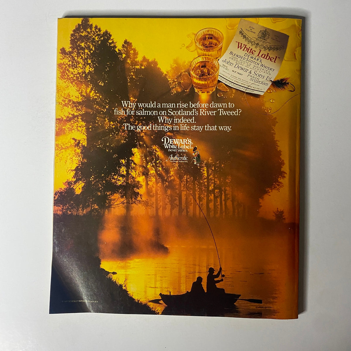 Advertisement from Fortune Magazine June 8, 1987, promoting Dewar's White Label Scotch Whisky within a lively outdoor scenic background.