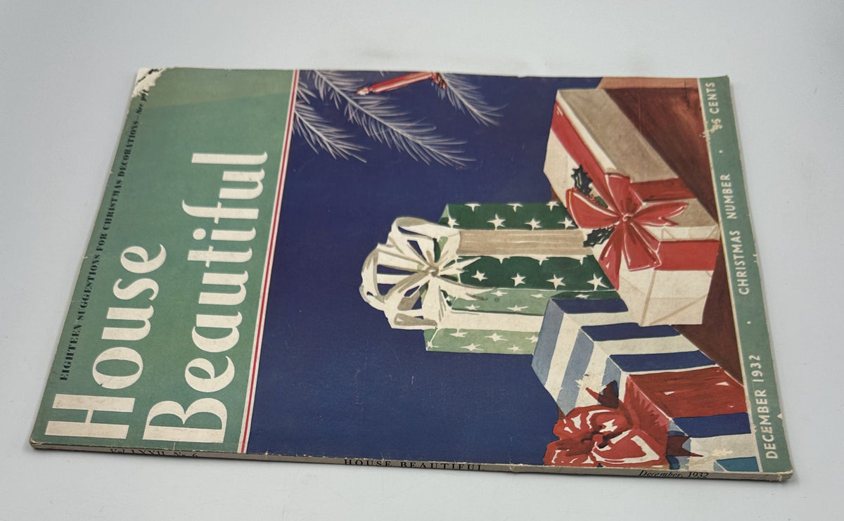 Side view of the December 1932 House Beautiful Magazine showcasing Christmas-themed gifts on the cover. The magazine offers suggestions for holiday decorations and interior design.