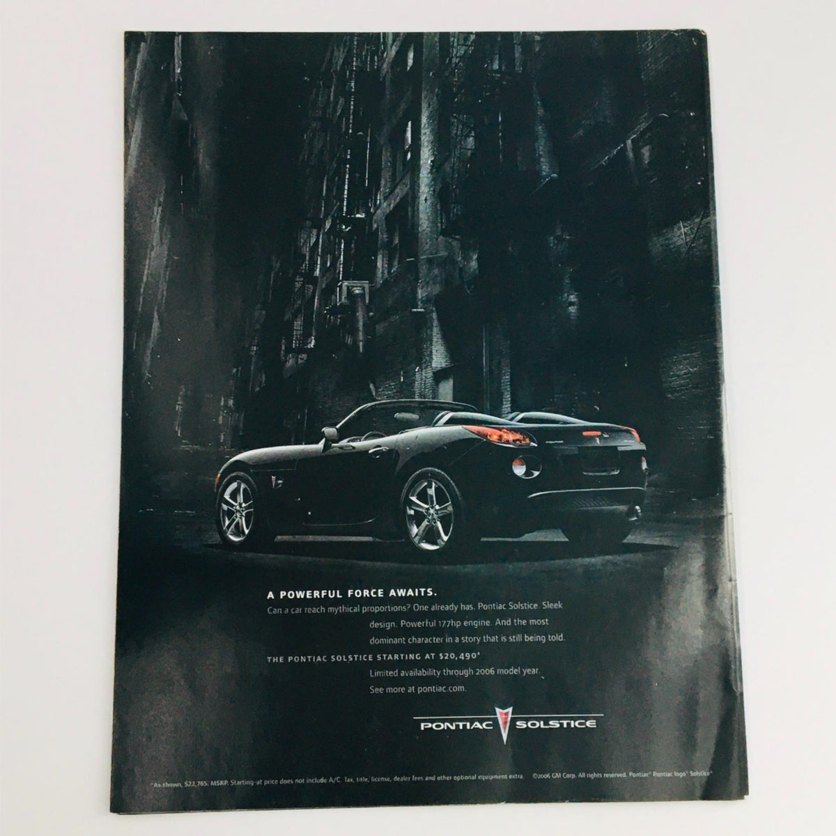 Back cover of Mad Magazine April 2006 No. 464 featuring a promotional advertisement for the Pontiac Solstice, showcasing the sleek design of the car against a dramatic urban backdrop.
