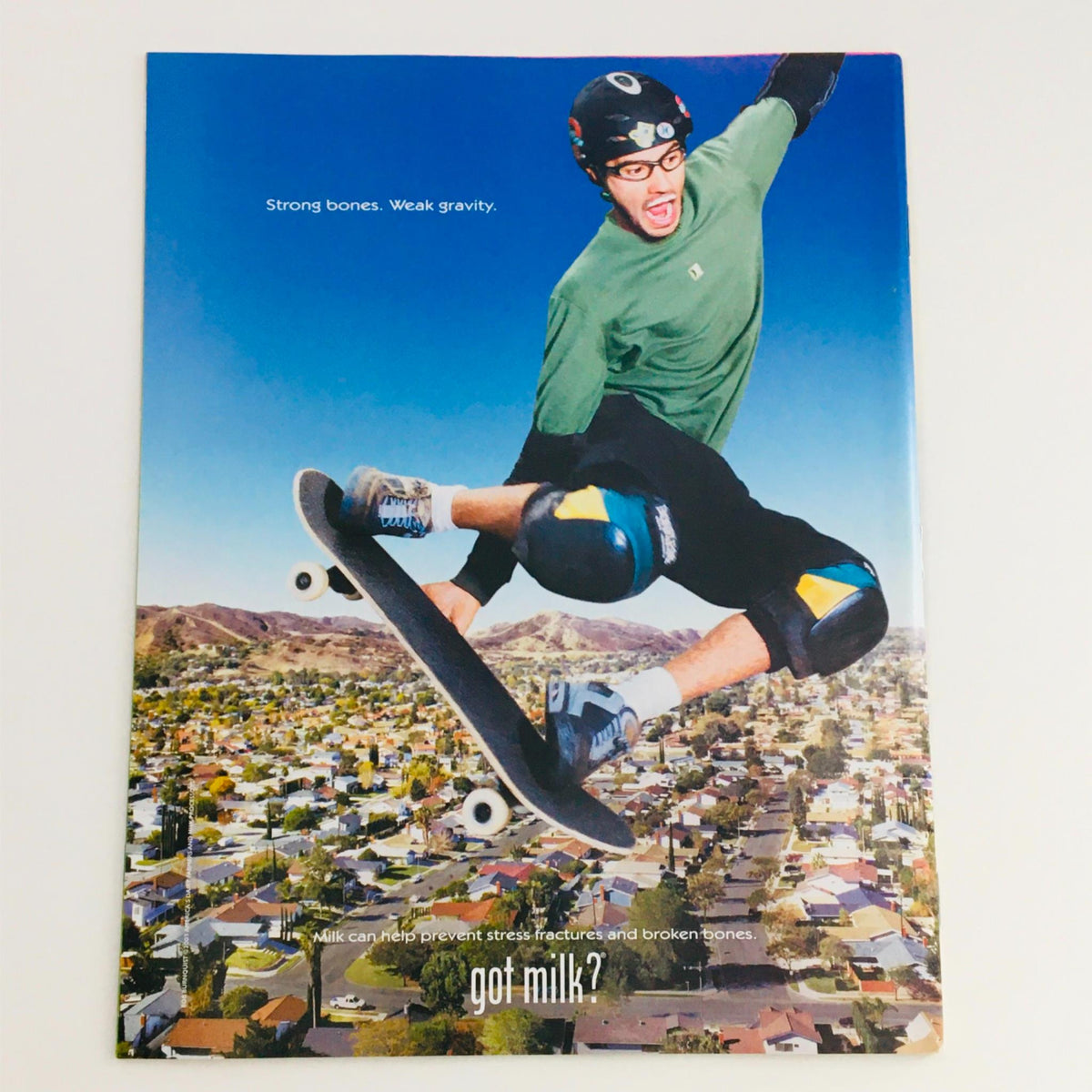 Promotional 'Got Milk?' advertisement featuring a skateboarder in mid-air, highlighting the slogan 'Strong bones. Weak gravity.'