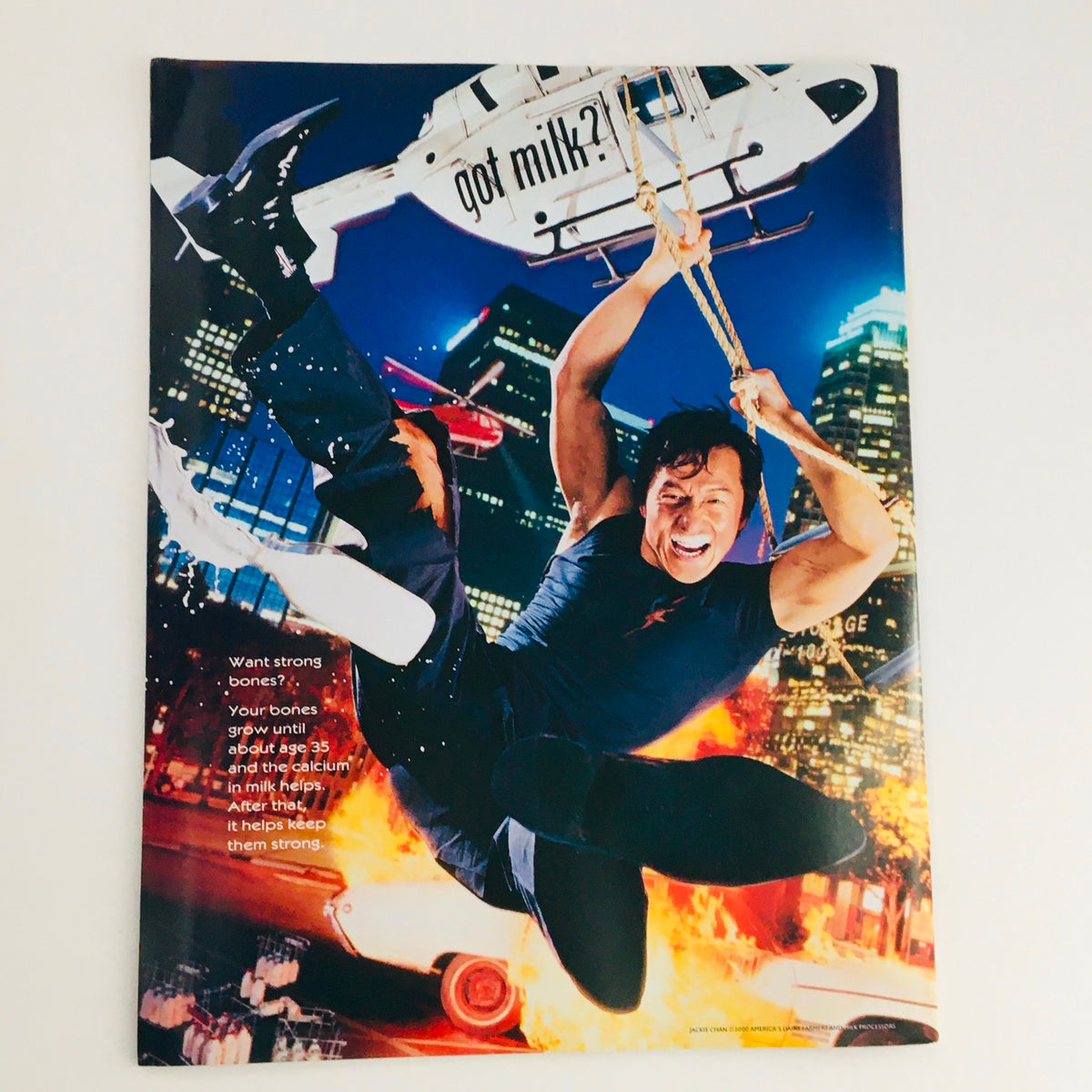 Mad Magazine June 2004 No. 406 advertisement showcasing a male actor in an action pose, promoting milk with a playful twist on fitness and health, complementing the magazine's characteristic humor.
