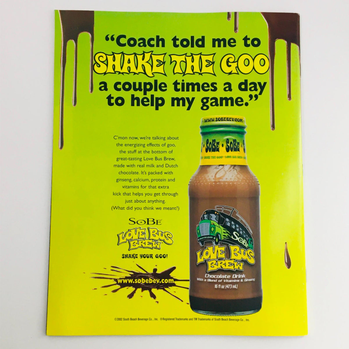 Back cover of Mad Magazine March 2002 No. 415 showing an advertisement for SoBe Love Bus Brew with a playful green background.