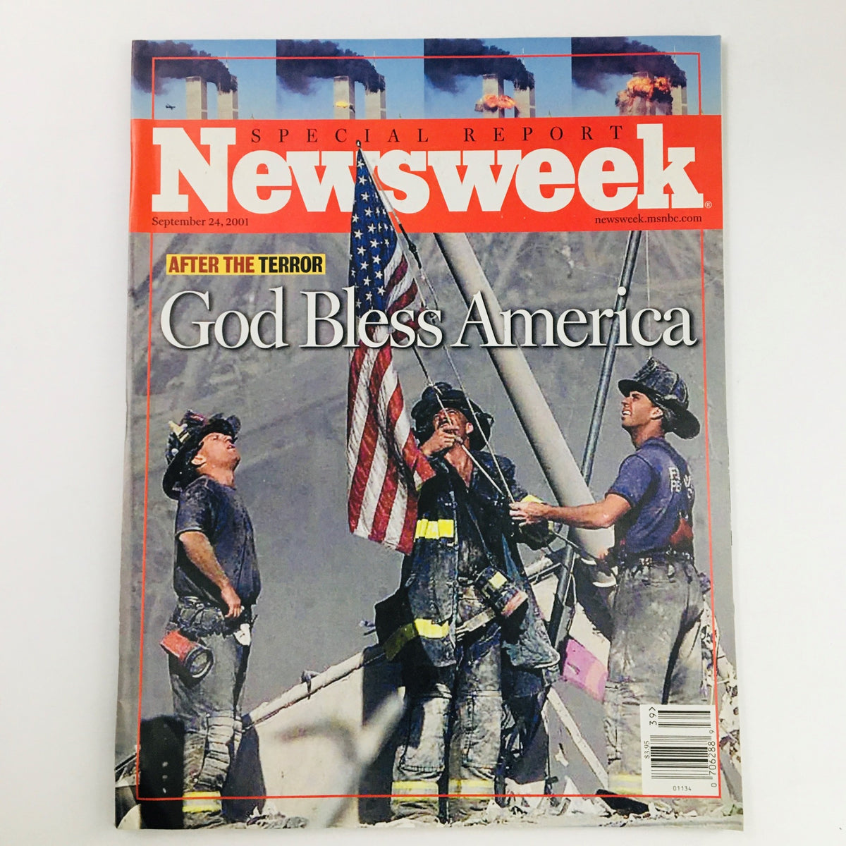 Cover of Newsweek Magazine September 24, 2001, featuring firefighters raising the American flag with the headline 'After The Terror: God Bless America'. A historic publication reflecting on the September 11 attacks.