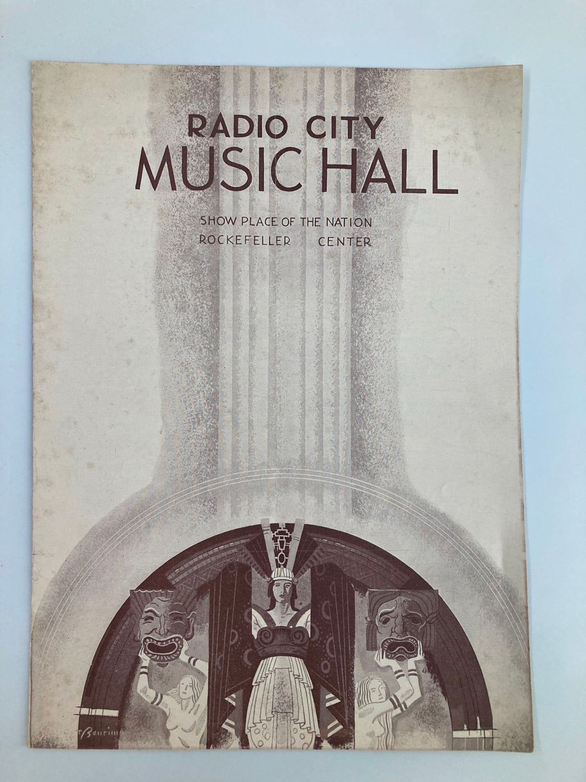Cover of the 1936 Radio City Music Hall Weekly magazine by Russell Markert, showcasing elegant design elements with the title prominently displayed and art deco influences.