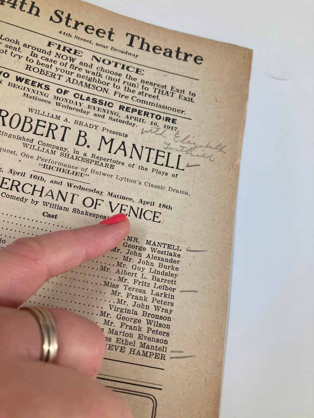 Close-up of the 1917 44th Street Theatre playbill detailing cast members and production information for 'The Merchant of Venice'.