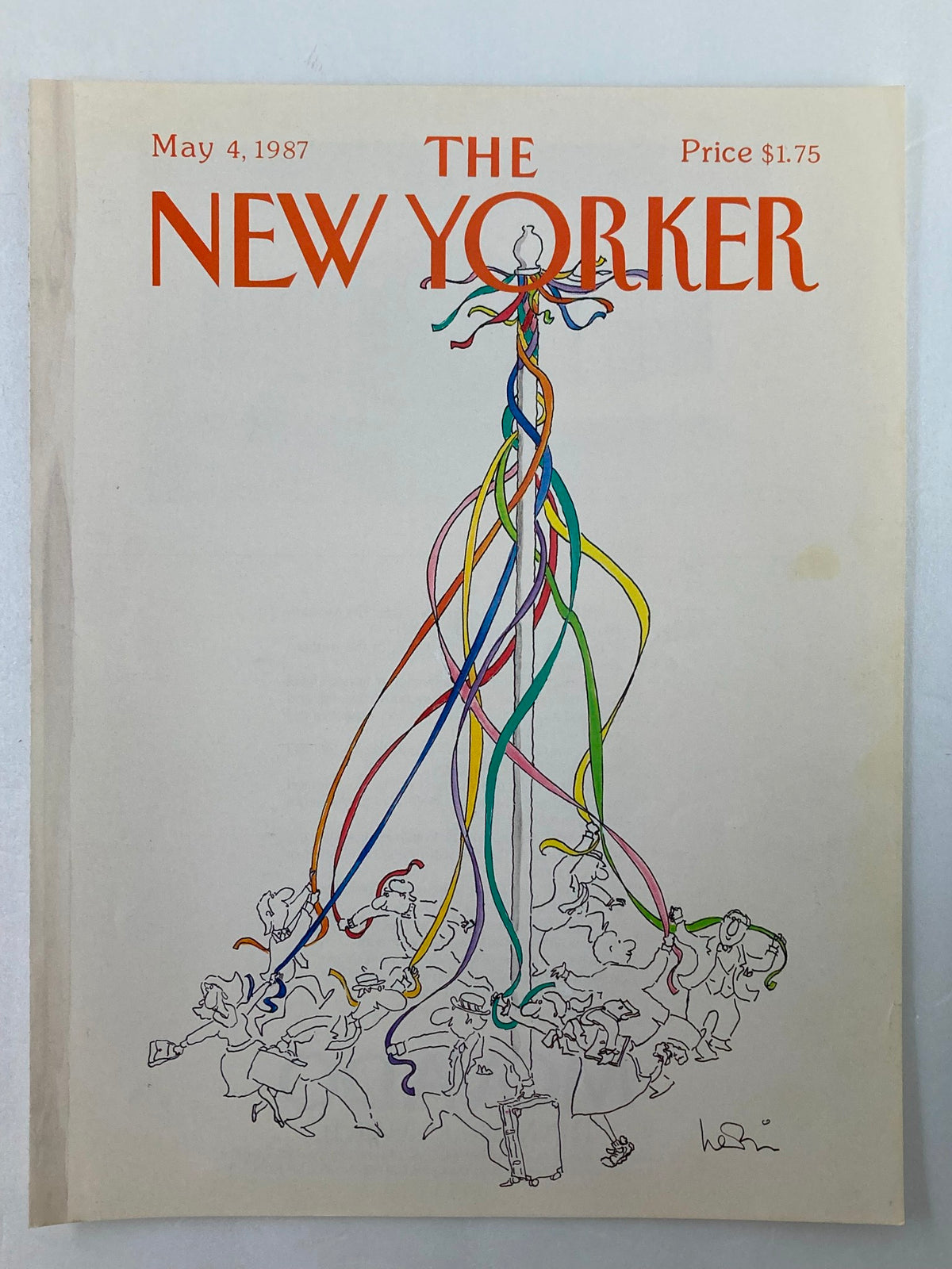 The New Yorker cover from May 4, 1987, showcasing a vibrant illustration with ribbons and people celebrating, crafted by artist Heidi Goennel.