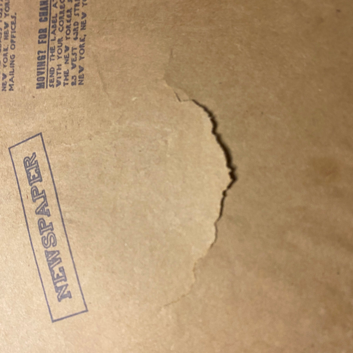 Close-up of back cover detailing on The New Yorker Full Magazine February 27, 1978, highlighting the 'NEWSPAPER' stamp and minor damage.