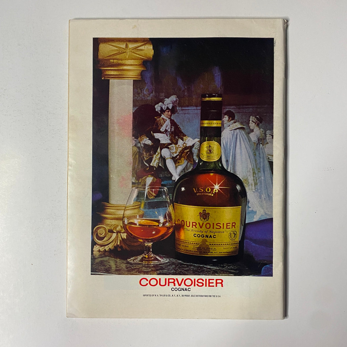 Vintage advertisement for Courvoisier Cognac from The New Yorker magazine March 17, 1975 showcasing the elegant bottle.