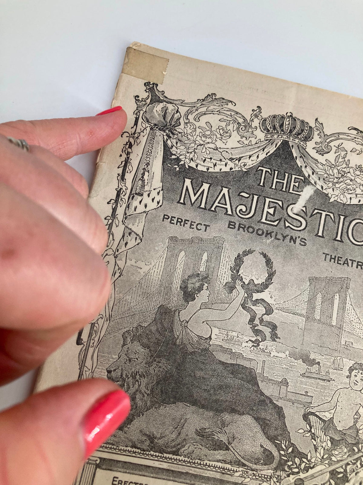 Close-up of the cover of the 1914 Playbill for 'Within The Law', highlighting wear and vintage features of The Majestic Theatre.