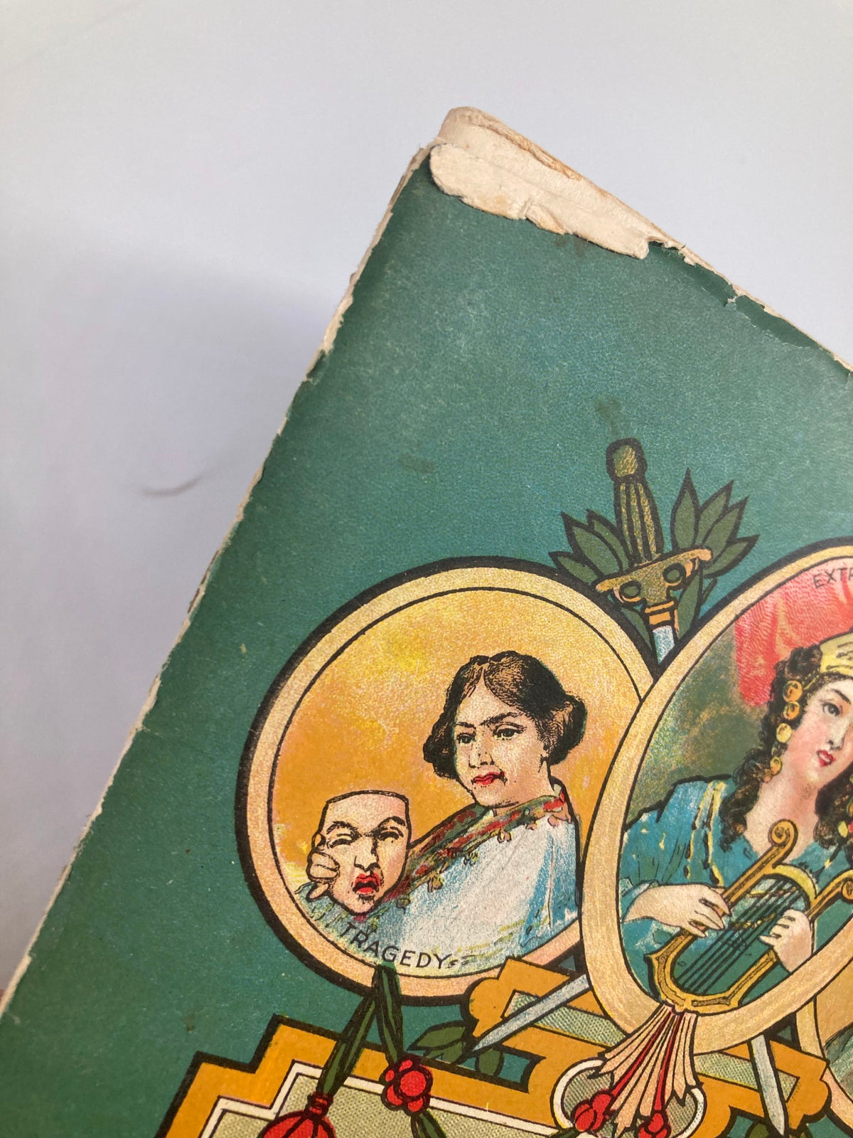 Close-up of the cover detail from the 1916 Teller's Broadway Theatre Playbill featuring Christie MacDonald, displaying theatrical masks and artistic design.