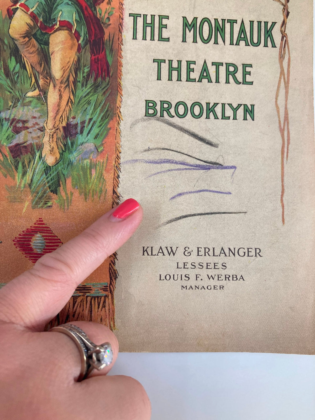 Close-up of the 1918 The Boomerang Playbill showing details of The Montauk Theatre, Brooklyn, with a finger pointing to marks on the cover.