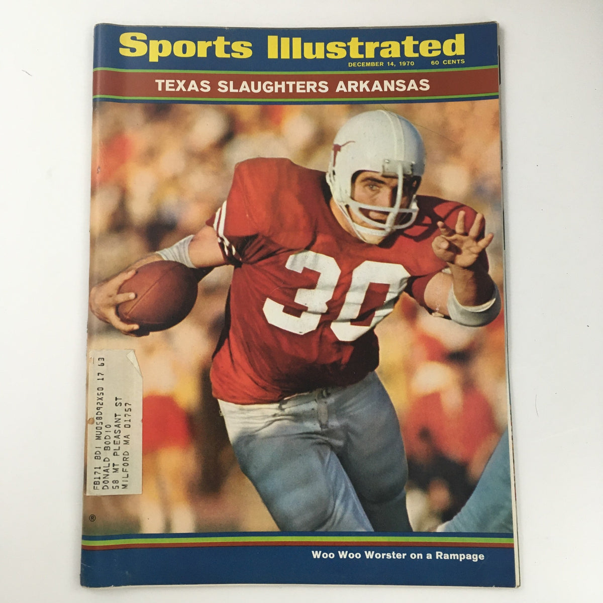 Cover of Sports Illustrated Magazine dated December 14, 1970, featuring the title 'Texas Slaughters Arkansas' and the cover story 'Woo Woo Worster on a Rampage', showcasing a player in a red football jersey.