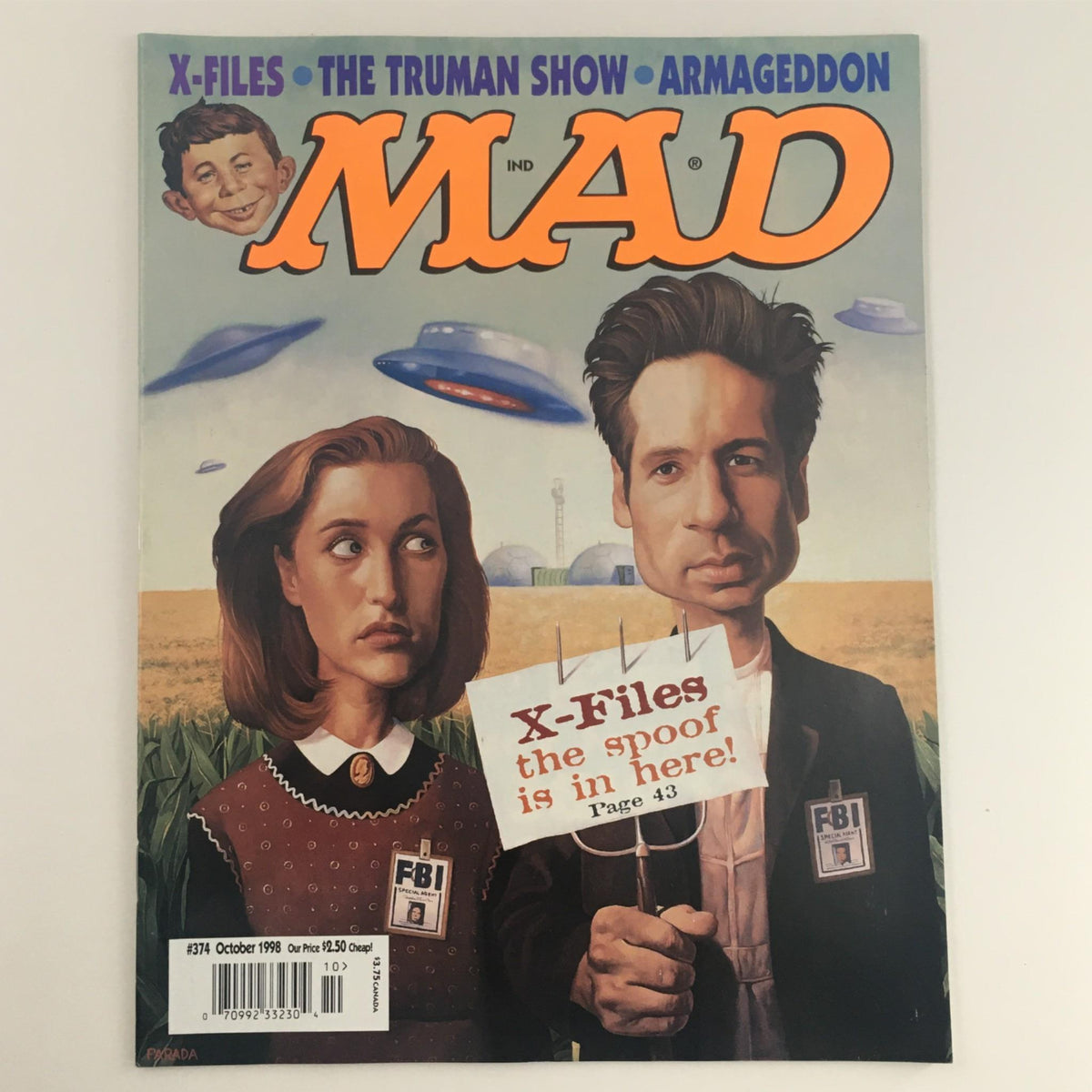 Cover of Mad Magazine October 1998 No. 374 featuring X-Files and The Truman Show with caricatures of Mulder and Scully, rated Very Fine VF 8.0 for collectors.