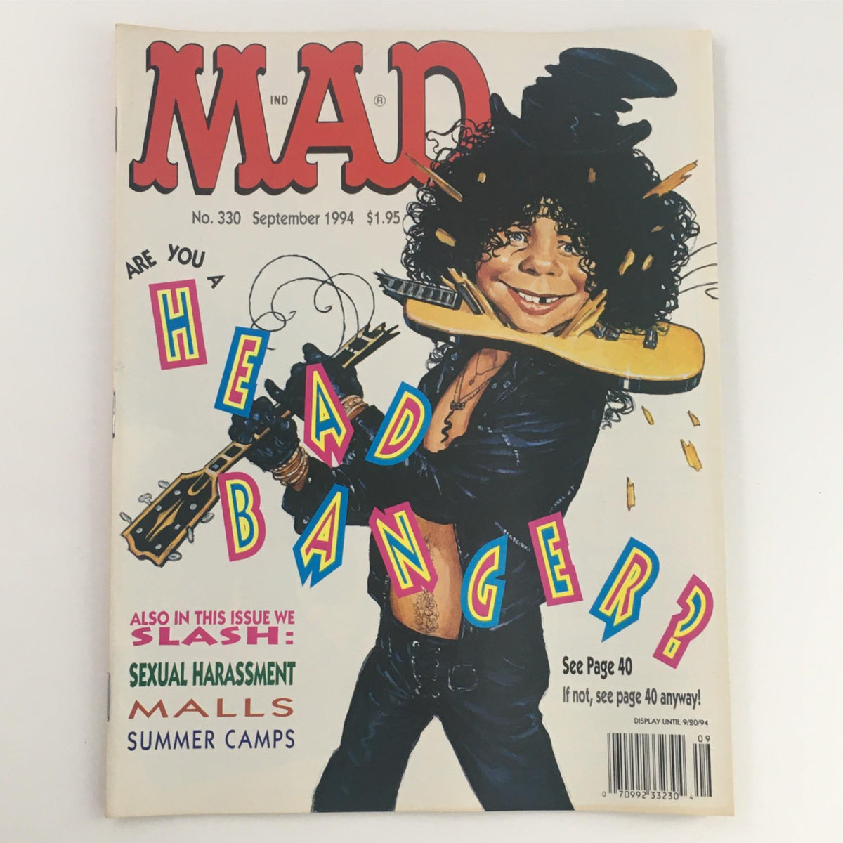 Mad Magazine September 1994 No. 330 cover featuring a cartoon character dressed as a rock musician, promoting the theme 'Are You Head Banger?' with vibrant colors and humorous graphics.