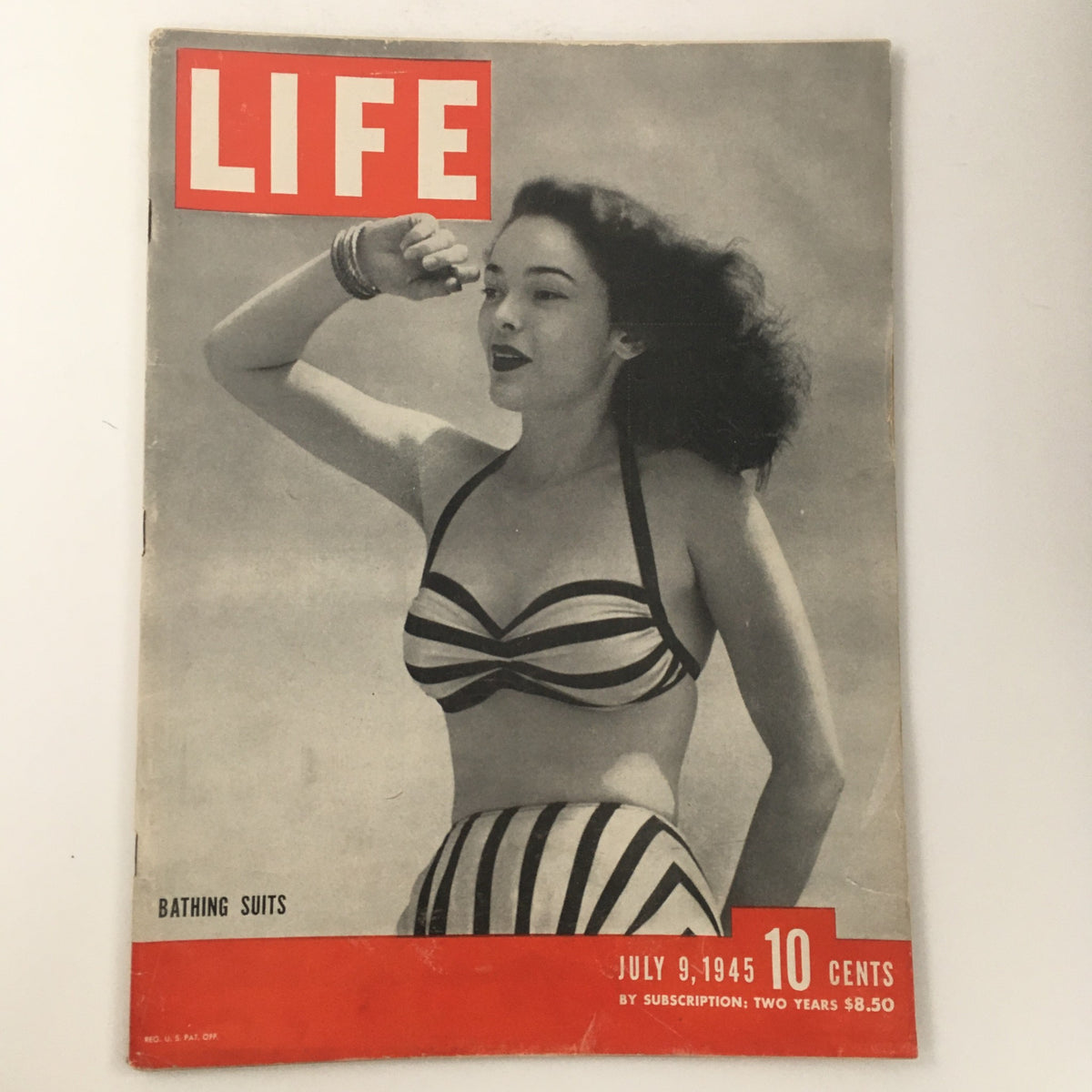 Cover of Life Magazine dated July 9, 1945 featuring a woman in a striped bathing suit, highlighting Ernie Pyle's story of G.I. Joe and a focus on bathing suits of the era.