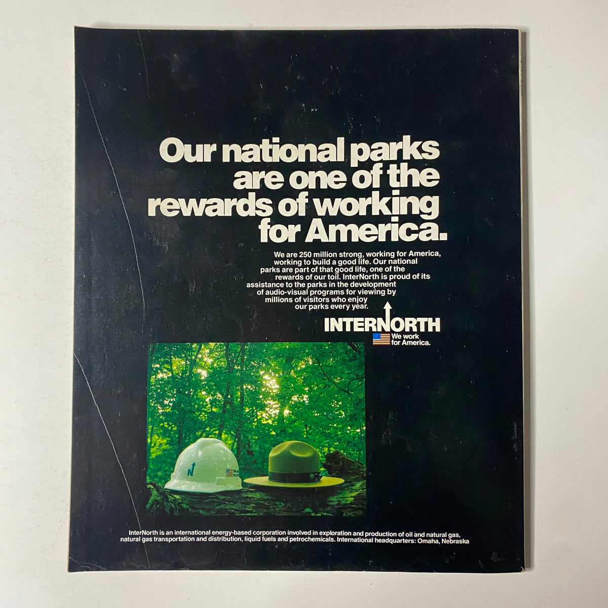 Back cover of Fortune Magazine September 3, 1984 with a statement about the rewards of working for America, featuring hard hats and a forest background.