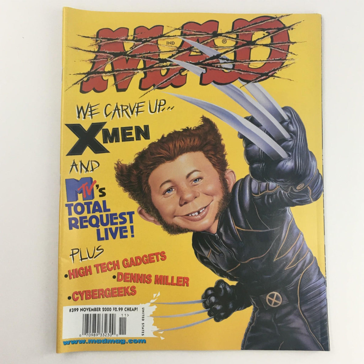 Mad Magazine November 2000 No. 399 cover featuring satirical art of a character resembling Wolverine from X-Men, showcasing the title 'We Carve Up X-Men'.