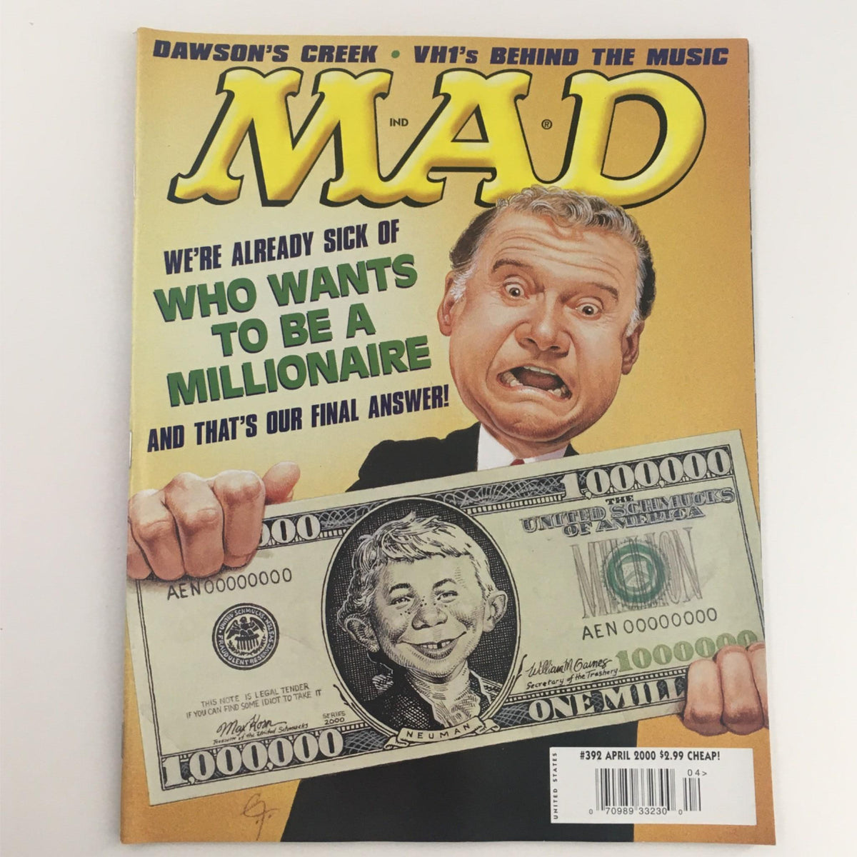 Mad Magazine April 2000 No. 392 cover featuring a humorous portrayal of a contestant from Who Wants To Be A Millionaire with oversized money.