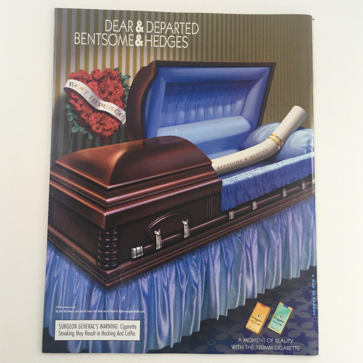 Back cover of Mad Magazine April 2000 No. 392 showcasing a satirical advertisement for a cigarette brand with a coffin and a humorous warning.