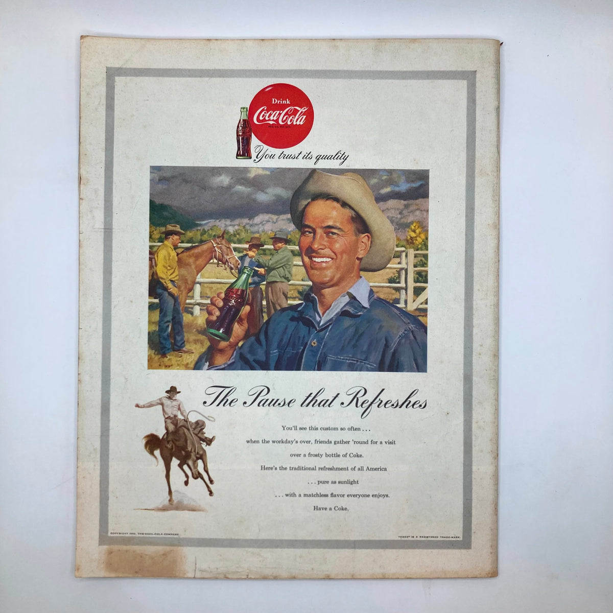 Advertisement page from the Saturday Evening Post Magazine August 8, 1953, featuring a vintage Coca-Cola advertisement with a smiling cowboy.