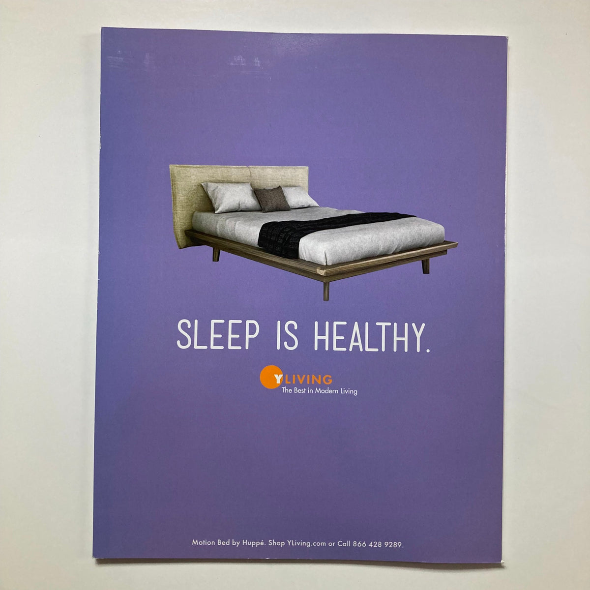 Back cover of Atomic Ranch Magazine Fall 2017 promoting a modern bed with the slogan 'SLEEP IS HEALTHY.' from YLiving.