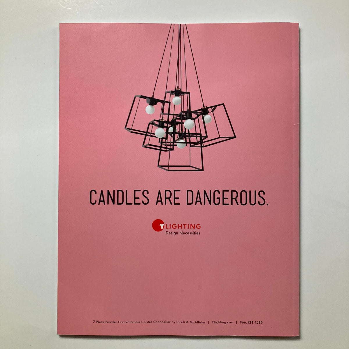 Back cover of Atomic Ranch Magazine Fall 2014 displaying a modern chandelier with the tagline 'Candles are Dangerous.' emphasizing contemporary design aesthetics.