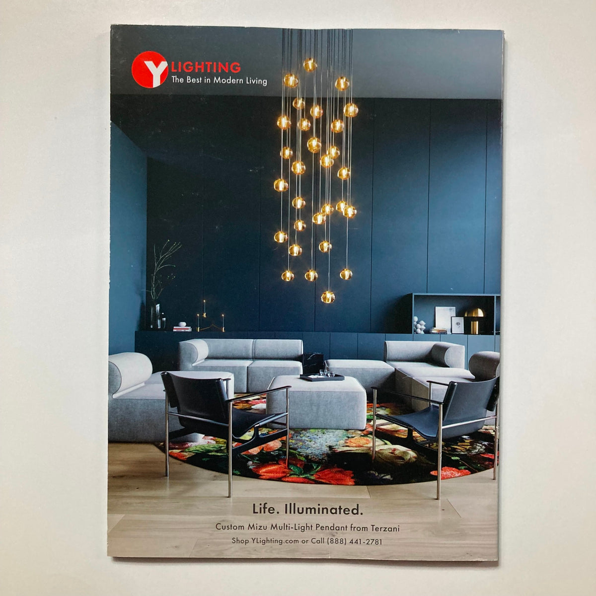 Back cover of Atomic Ranch Magazine 2020 The Design Issue advertising modern lighting solutions in a stylish interior.