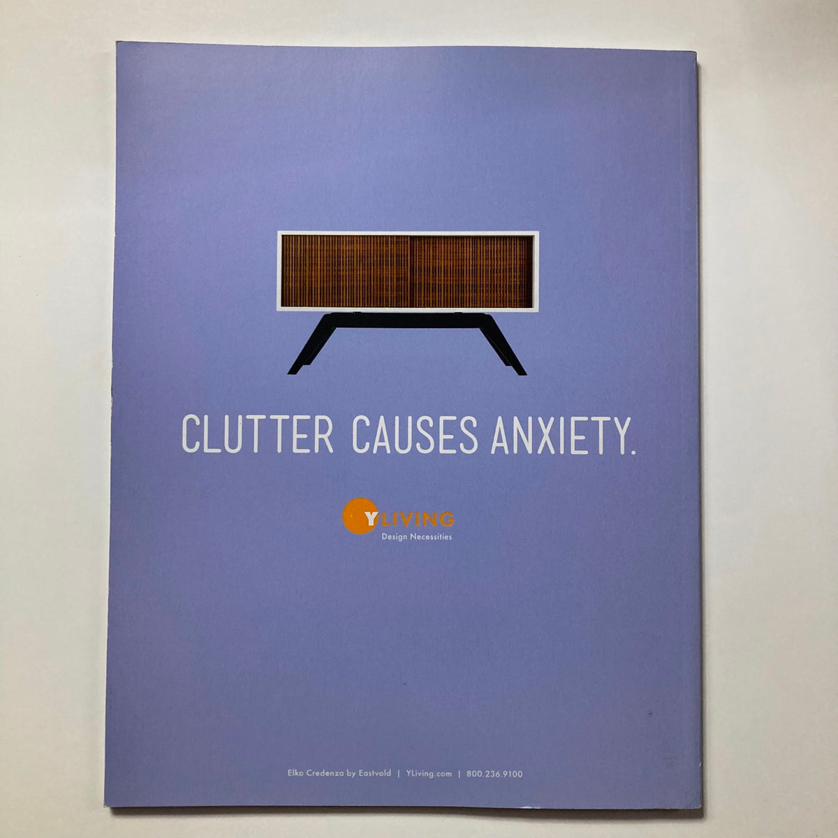 Atomic Ranch Magazine Winter 2015 back cover featuring an ad promoting minimalist design, emphasizing the theme of reducing clutter.