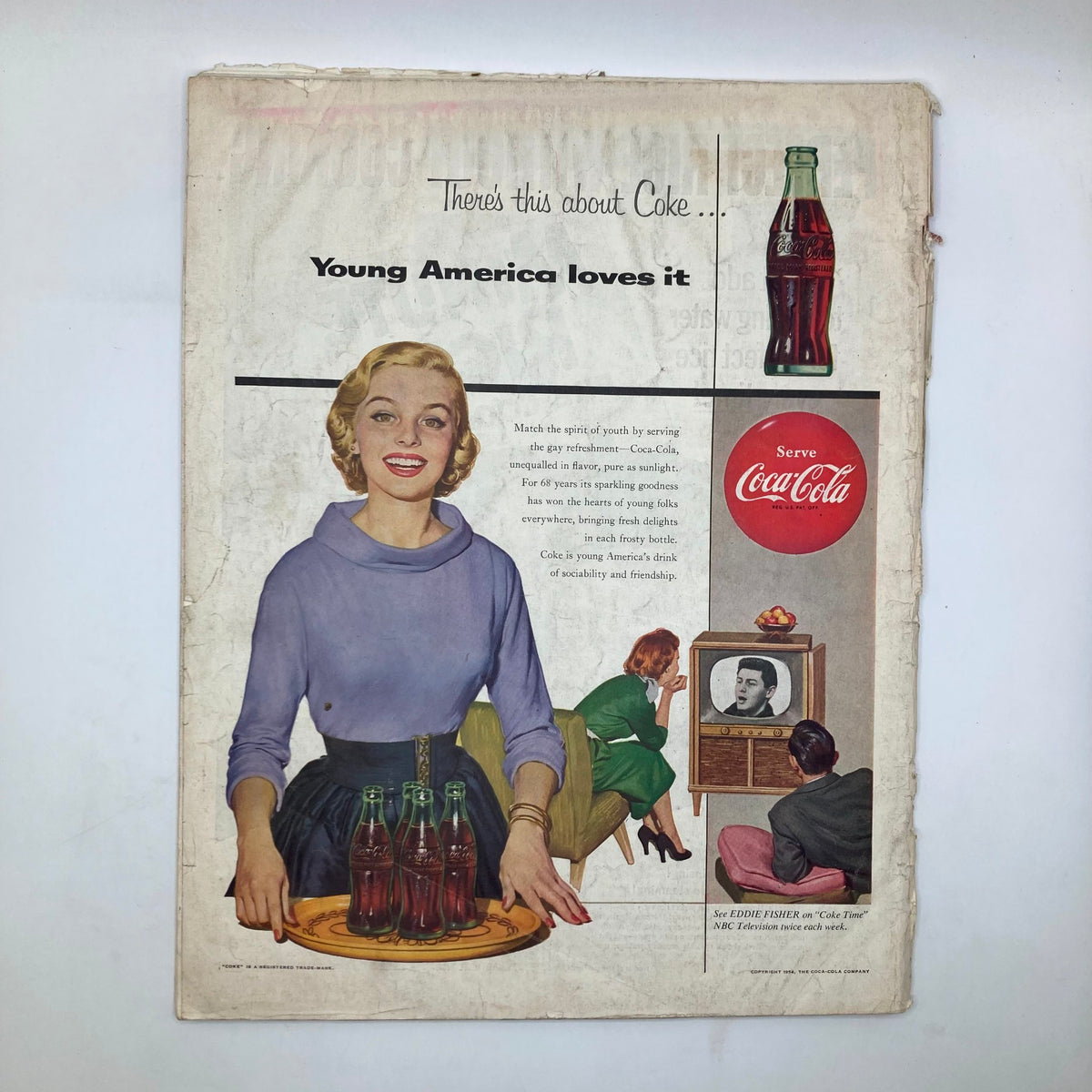 Advertisement page from Saturday Evening Post Magazine from September 4, 1954, featuring a vintage Coca-Cola ad with a smiling woman presenting bottles of Coke and showing a family watching TV.