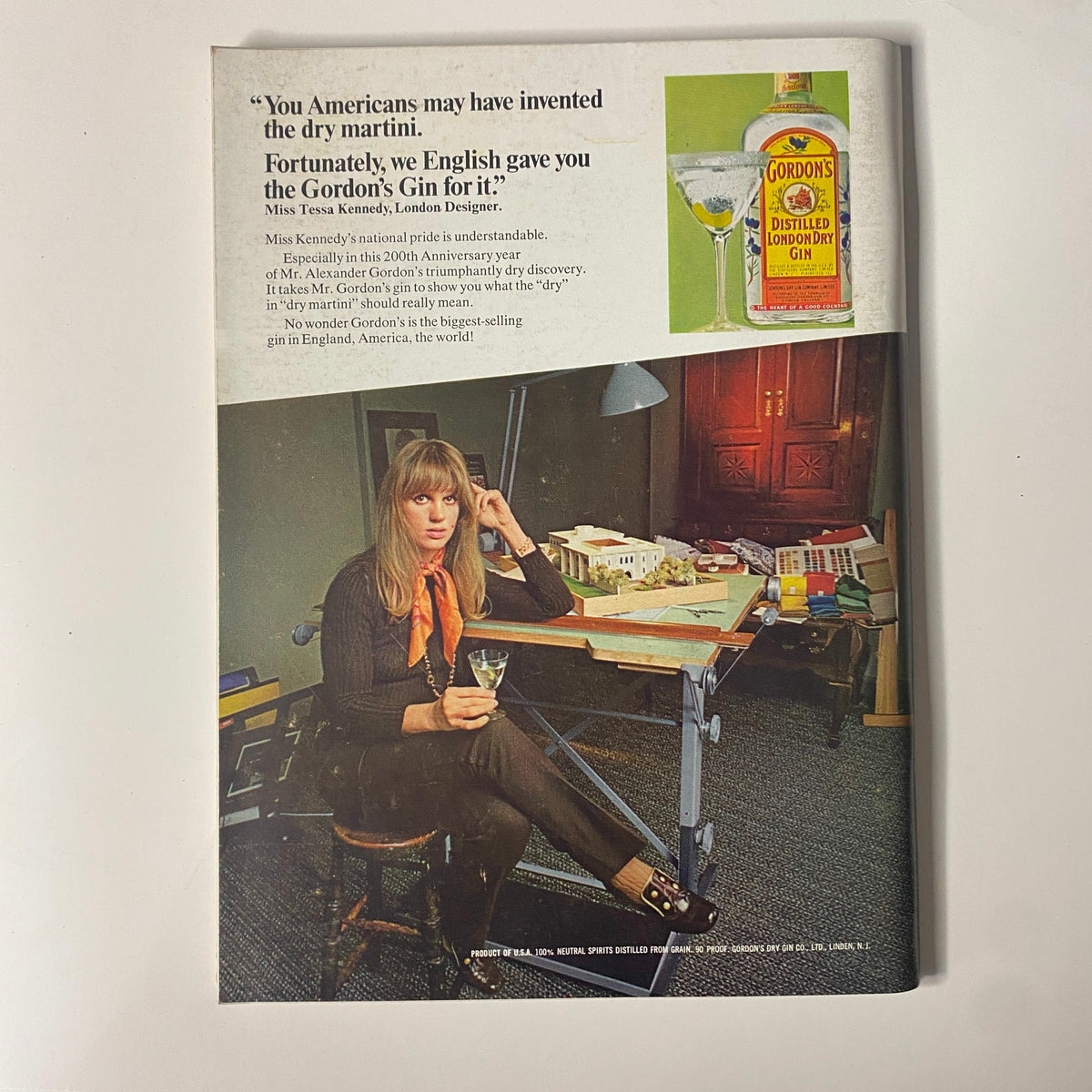 Vintage advertisement from Playboy Magazine May 1969 featuring Tessa Kennedy, a London designer, holding a cocktail glass. The ad promotes Gordon's London Dry Gin with a quote about the dry martini, reflecting 1960s cocktail culture. This image complements the May 1969 issue showcasing Playmate Sally Sheffield.