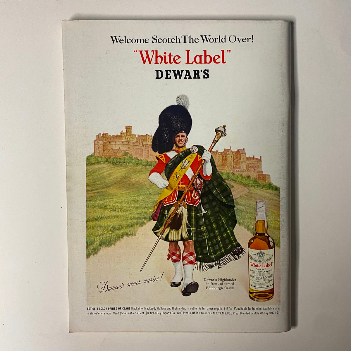 Ad for Dewar's White Label scotch whisky featured in Playboy Magazine April 1966, showcasing a Scottish Highlander in traditional attire.
