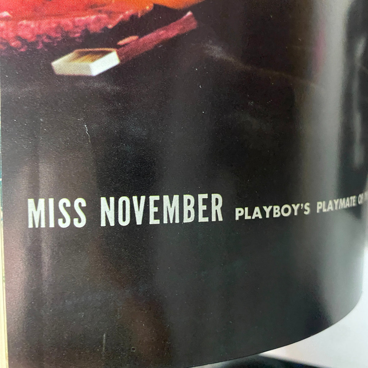 Close-up of the phrase 'Miss November Playboy’s Playmate of the Month' featured in the November 1967 Playboy Magazine, denoting Kaya Christian's spotlight.