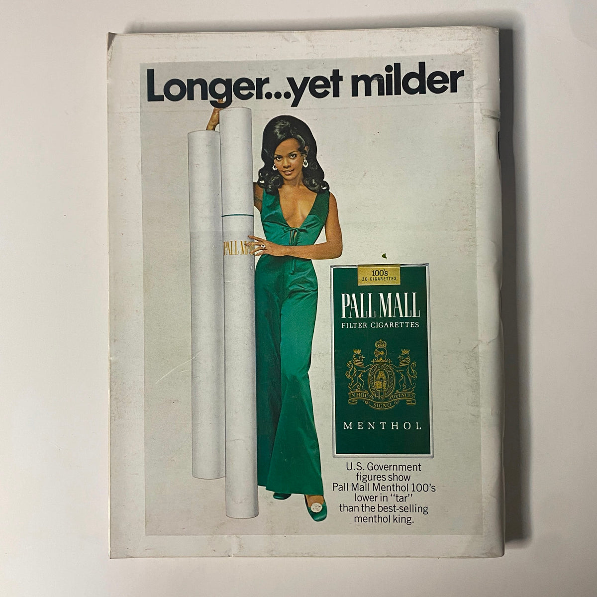 Cover of Playboy Magazine November 1969 featuring Claudia Jennings as Playmate of the Month, showcasing a vintage advertisement for Pall Mall cigarettes with a stylish model in a green outfit.