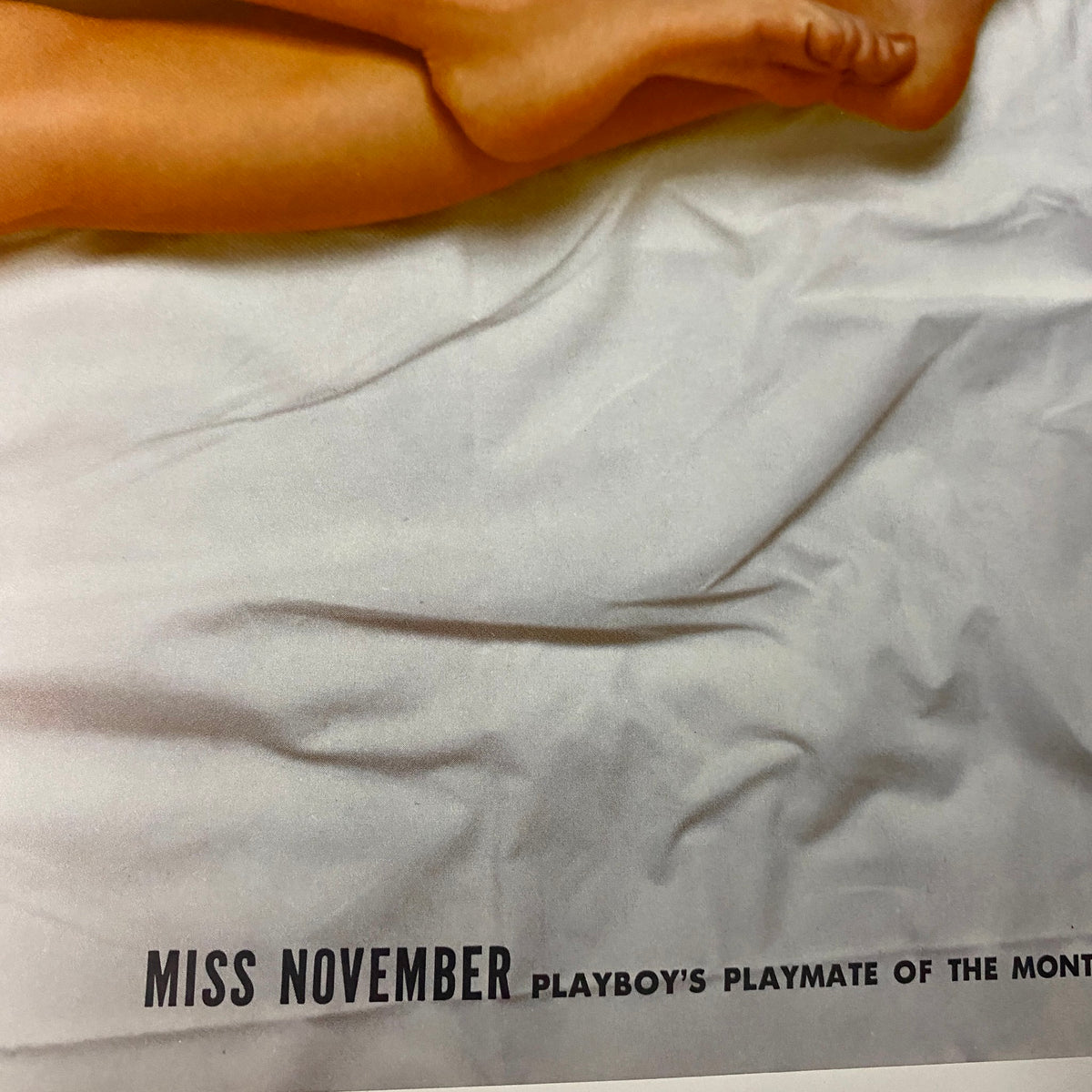 Close-up of the centerfold page from Playboy Magazine November 1964, showcasing Miss November, Kai Brendlinger, emphasizing her recognition as Playboy's Playmate of the Month.