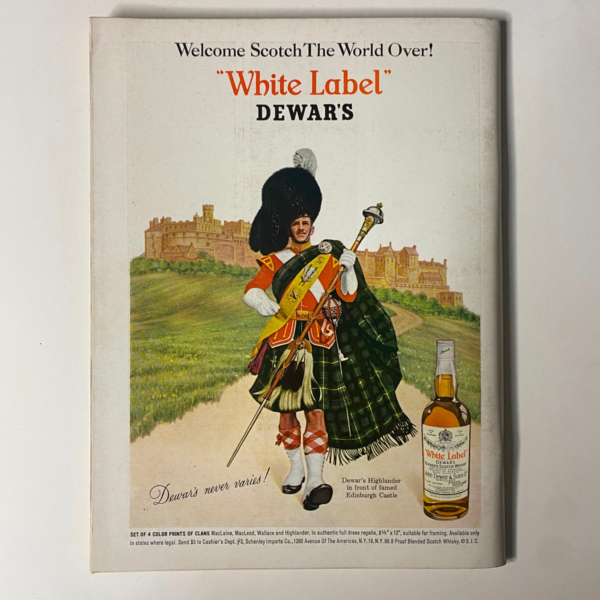 Back cover of Playboy Magazine October 1964 showcasing a Dewar's Scotch advertisement featuring a Highlander in traditional dress against the backdrop of Edinburgh Castle. This vintage ad adds historical context to this collectible magazine.